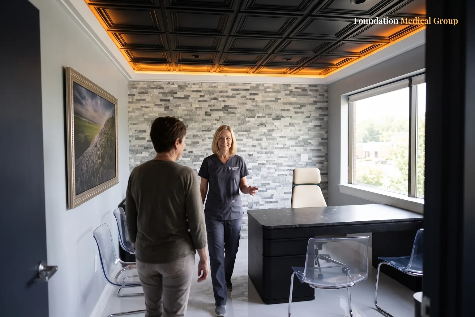 A clinician walking a patient into a consult office past a framed landscape print, both seen in the middle distance