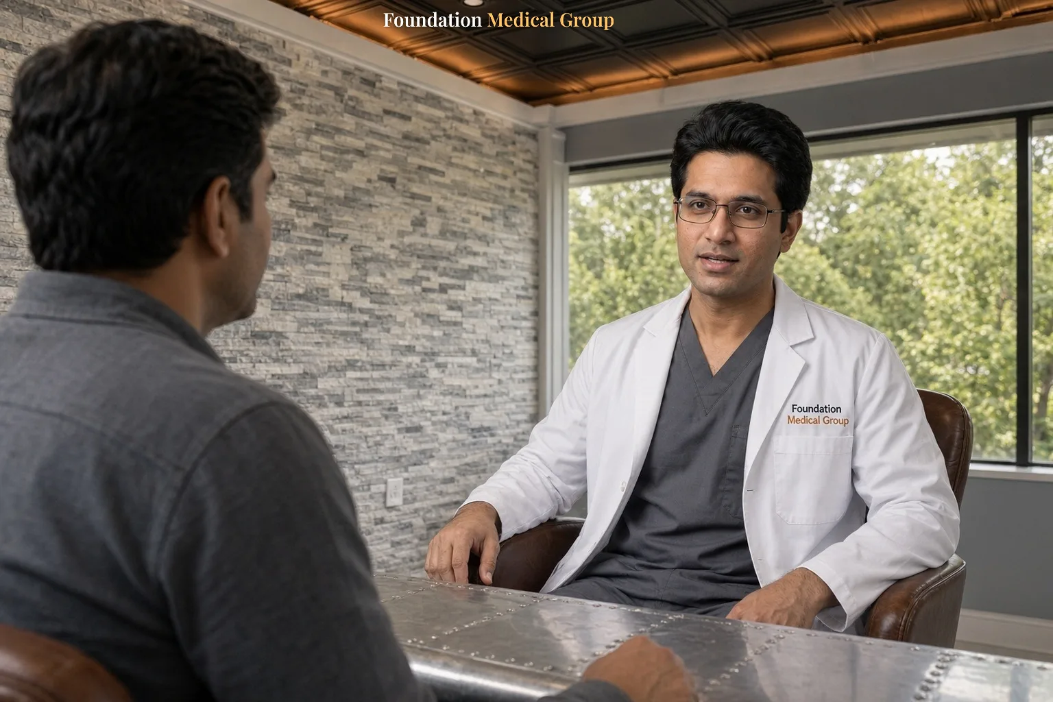 A clinician explains insurance coverage for ketamine therapy to a patient at a desk