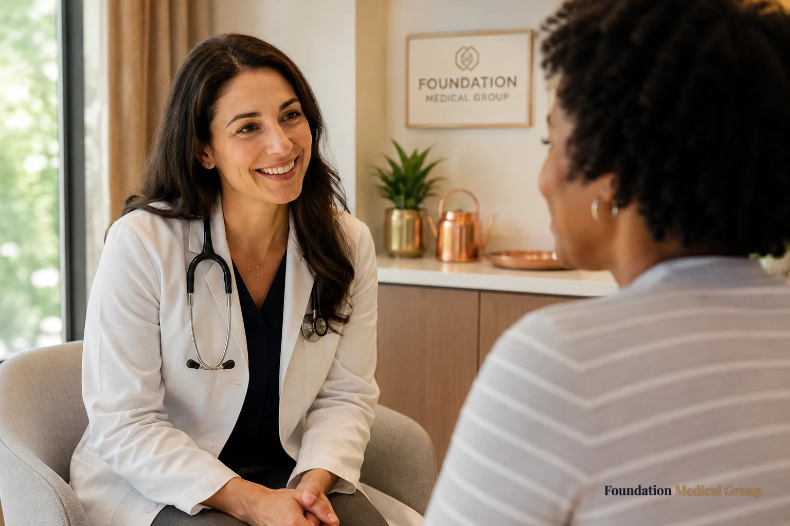 A caring doctor leans in warmly toward a patient with an open, nonjudgmental smile, reassuring them in a bright, welcomi