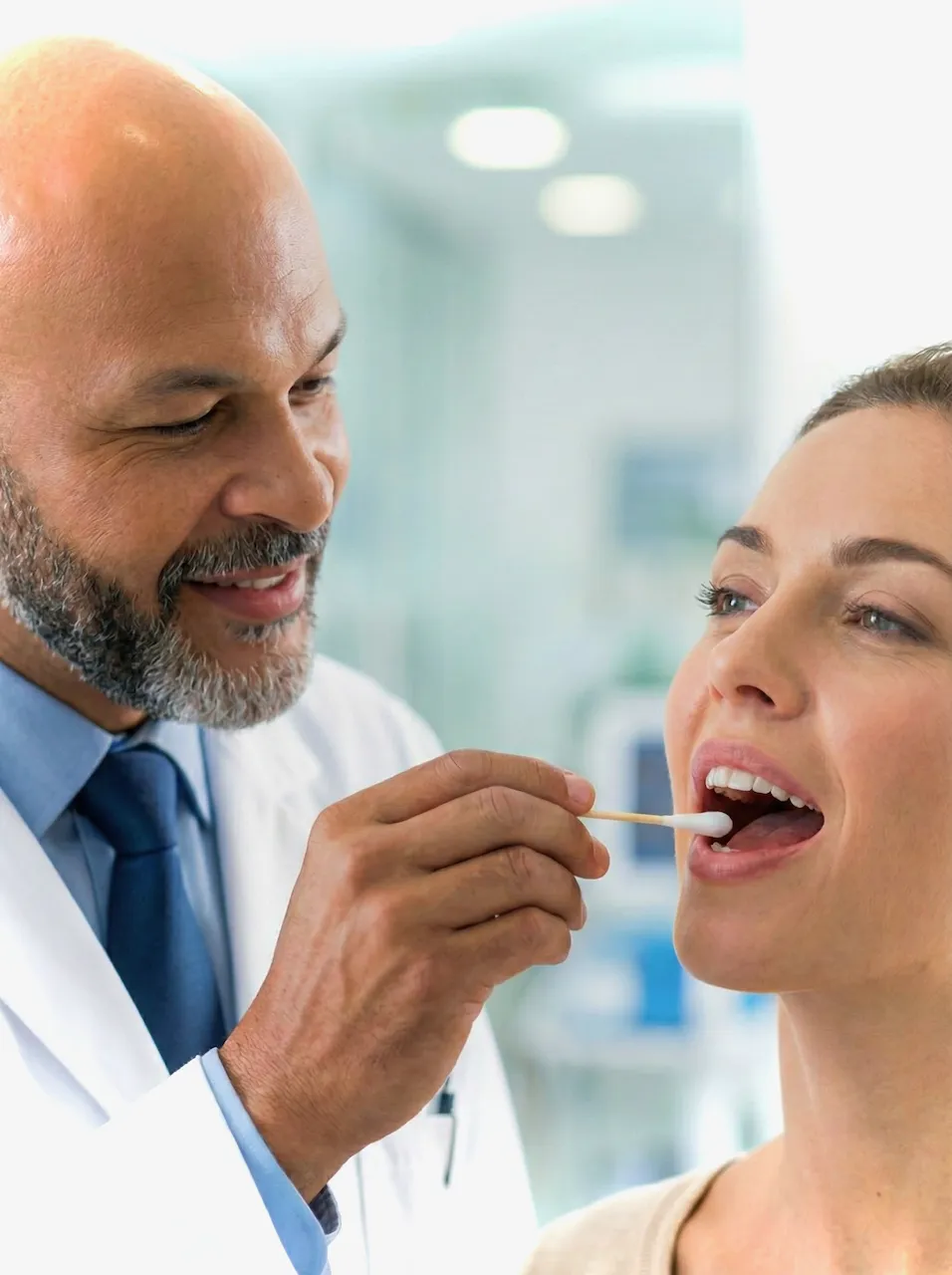 Patient giving cheek swab for GeneSight genetic testing